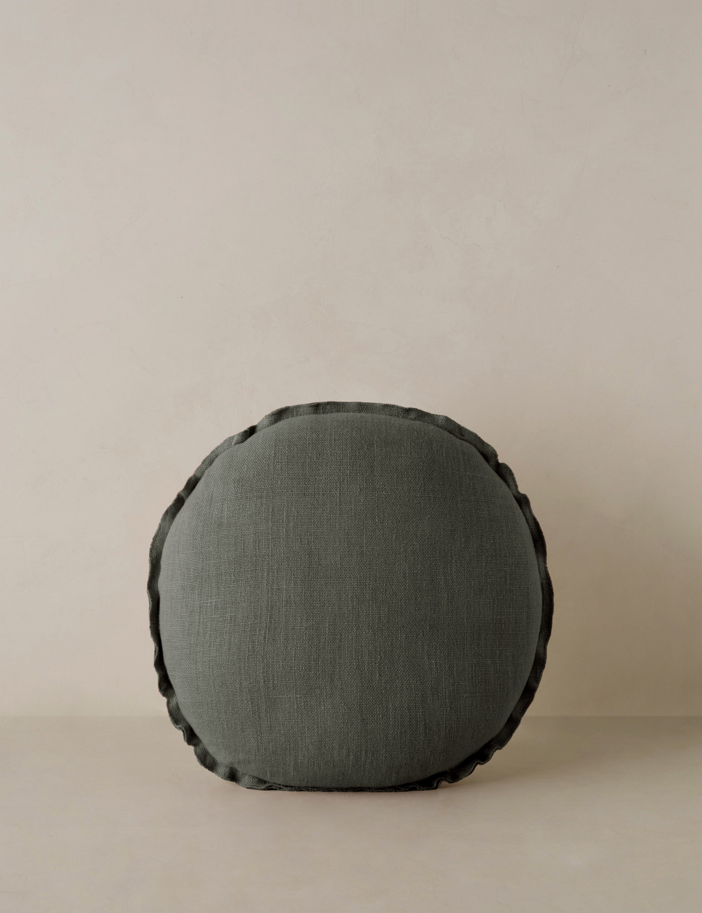 #color::conifer | Arlo linen flange trim round pillow.