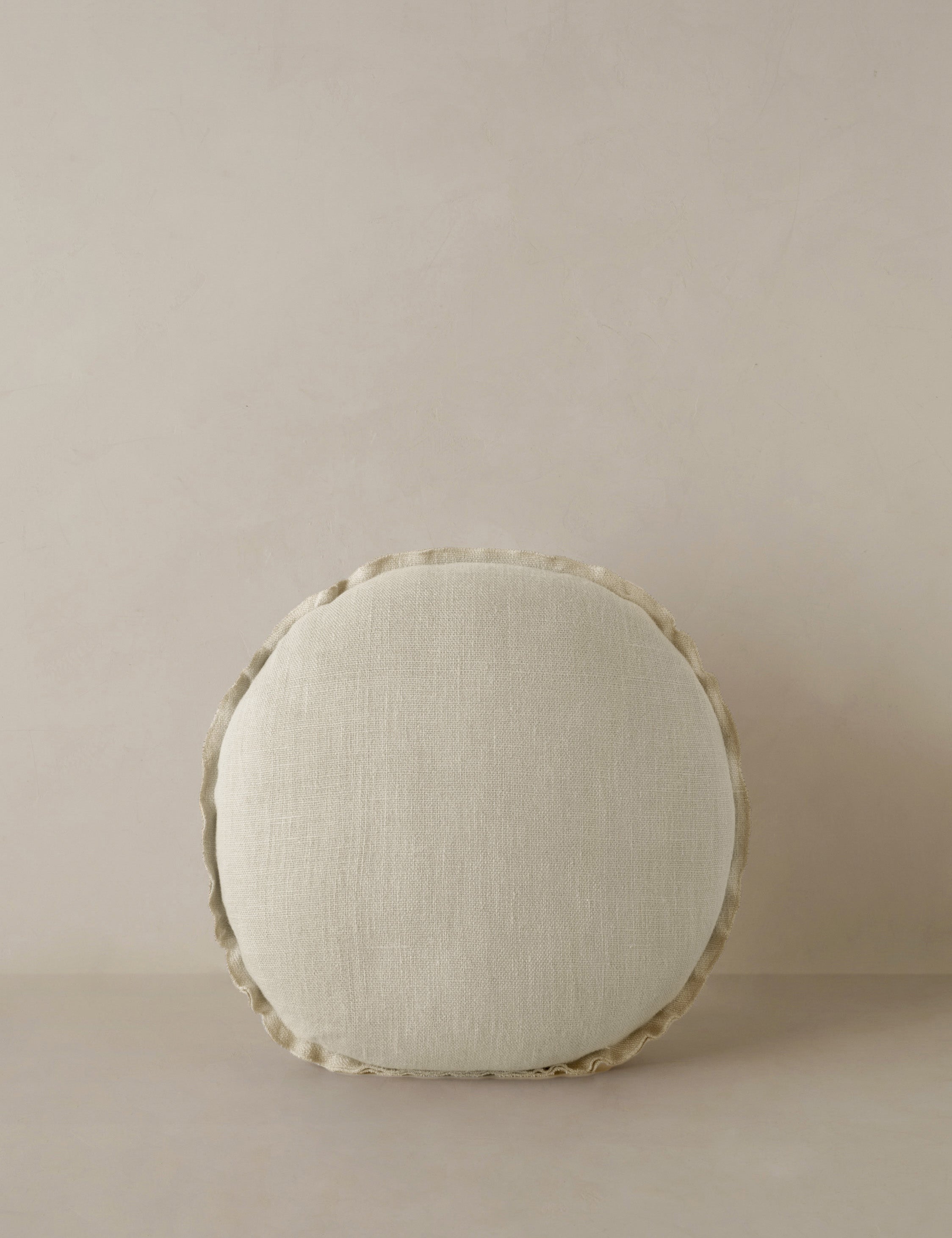 #color::light-natural | Arlo linen flange trim round pillow.